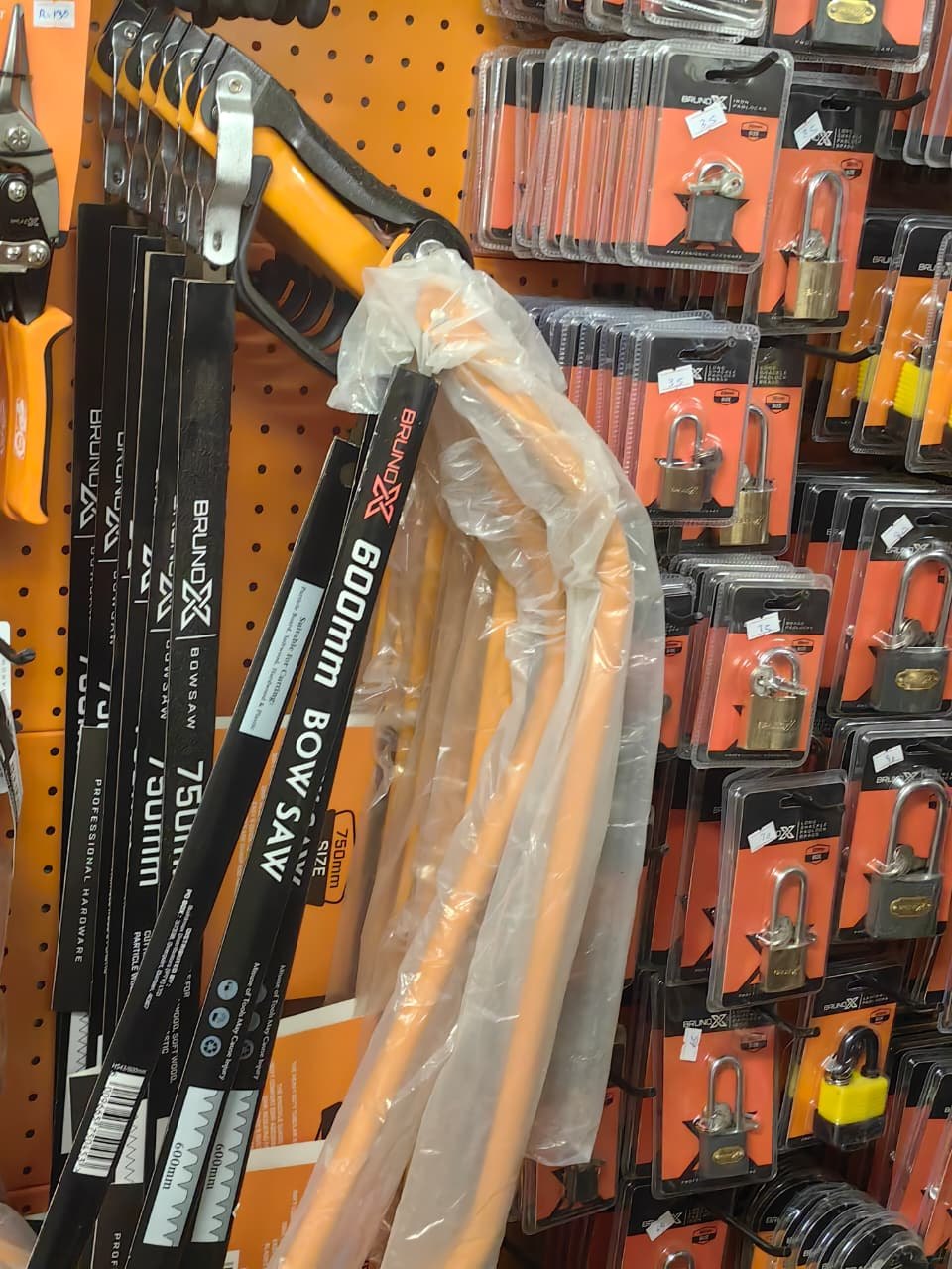 Hand tools and saws on a hardware display